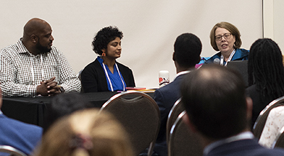 Photo: Marcell Walker, Menaka Mohan and Mary Schmidt.